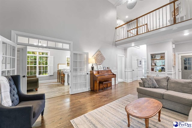 2409 Sarazen Ct, Florence, SC 29506 - living area with a high ceiling, wood finished floors, baseboards, ornamental molding, and ceiling fan