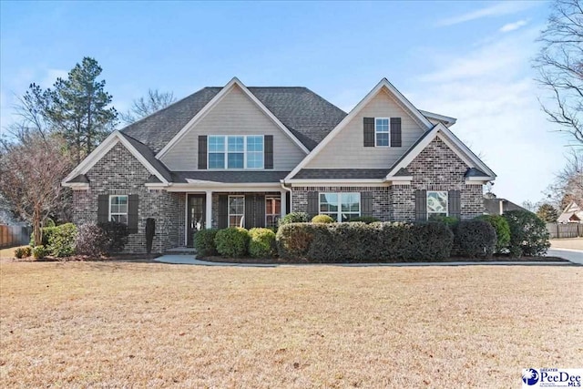 craftsman house with a front lawn