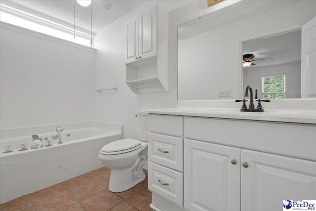 full bath with toilet, a tub, ceiling fan, and tile patterned floors