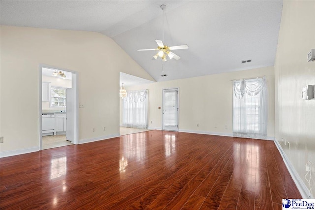 unfurnished living room featuring plenty of natural light, wood finished floors, and visible vents