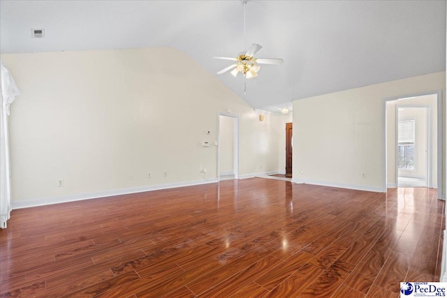 unfurnished living room featuring ceiling fan, high vaulted ceiling, wood finished floors, visible vents, and baseboards