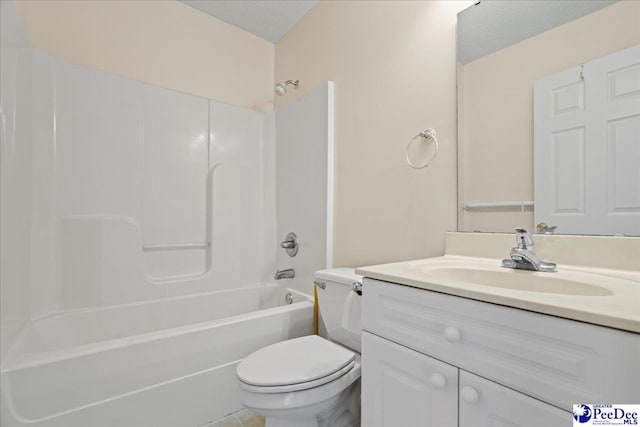 full bath with shower / bathing tub combination, vanity, toilet, and a textured ceiling