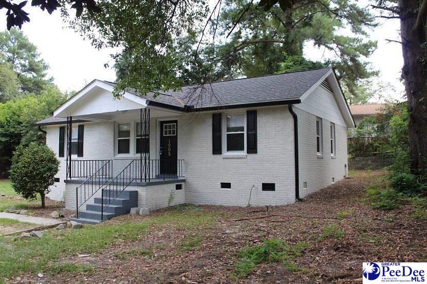 1005 Sunnyside Dr, Cayce, SC 29033 - view of front of home with crawl space, brick siding, covered porch, and a shingled roof