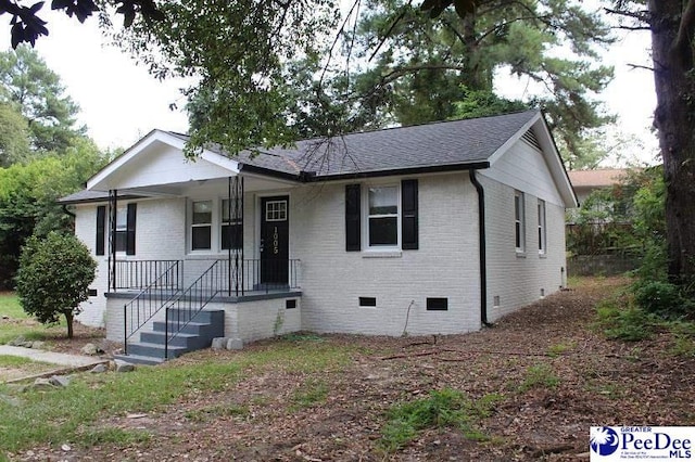 1005 Sunnyside Dr, Cayce, SC 29033 - view of front of home with crawl space, brick siding, covered porch, and a shingled roof