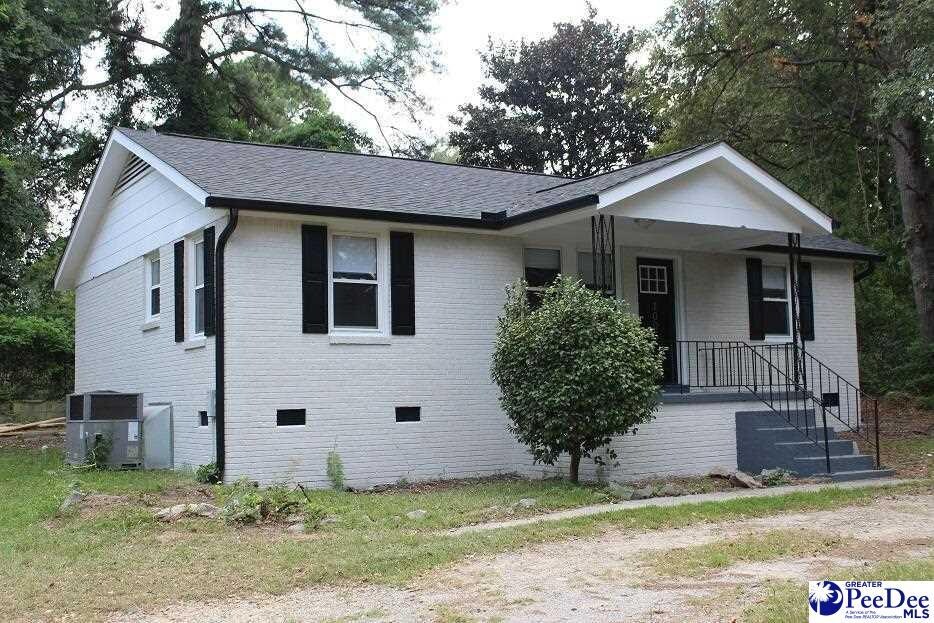 1005 Sunnyside Dr, Cayce, SC 29033 - view of front of home featuring brick siding, a shingled roof, crawl space, and covered porch