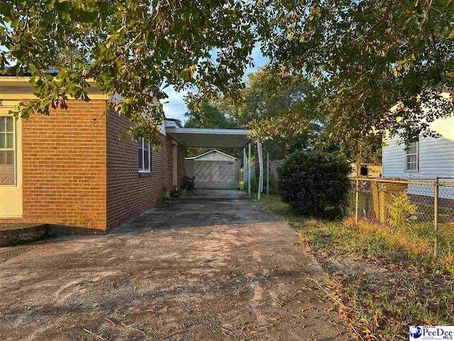 view of property exterior featuring a carport