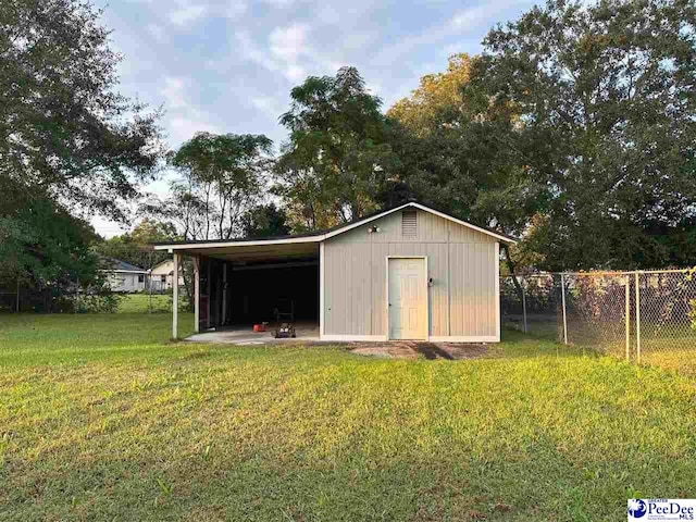 view of outbuilding with a lawn