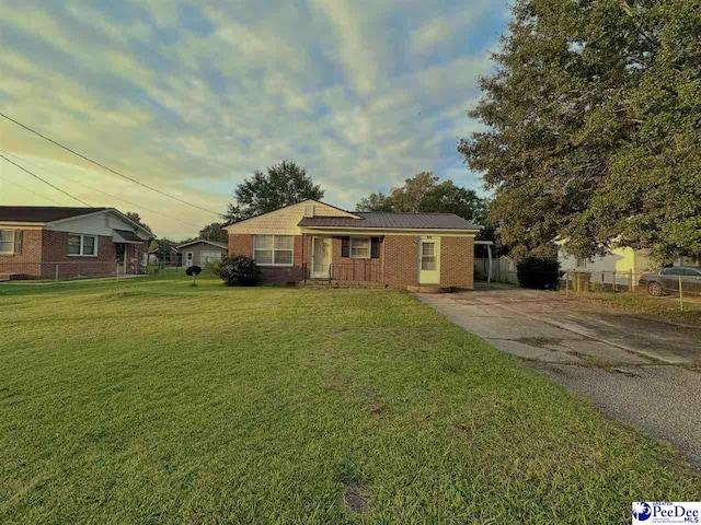 ranch-style house with a front yard