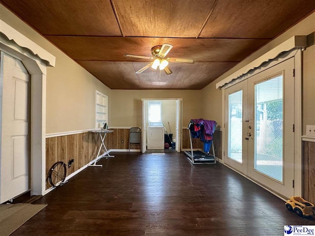 exercise area featuring french doors, dark wood-type flooring, wooden ceiling, ceiling fan, and washer / clothes dryer