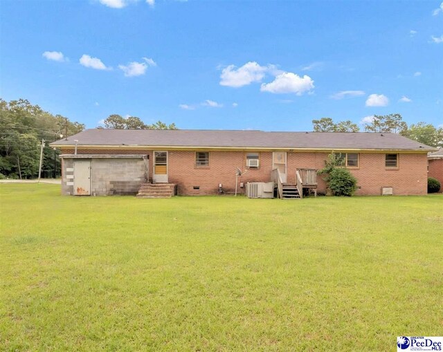 1709 N Irby St, Florence, SC 29501 - back of property featuring a yard, brick siding, and crawl space