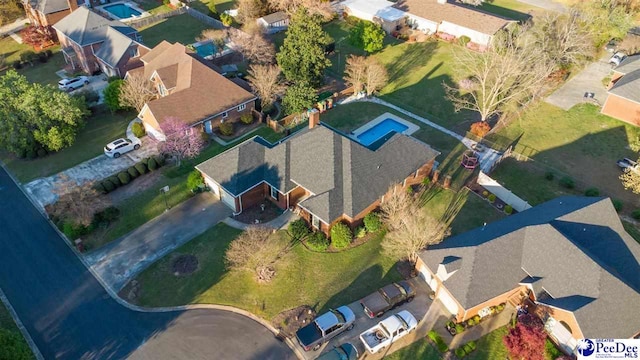 birds eye view of property with a residential view