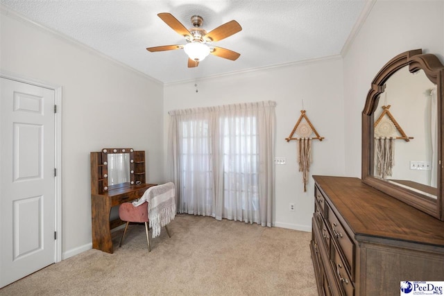 sitting room with a ceiling fan, light carpet, crown molding, and a textured ceiling