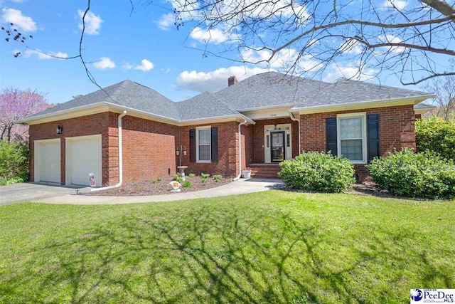 single story home featuring driveway, a chimney, brick siding, a front lawn, and a garage