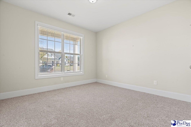 view of carpeted spare room