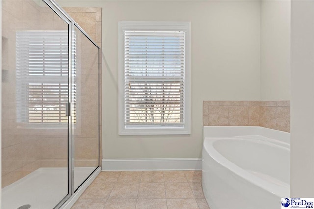 bathroom with tile patterned floors and plus walk in shower