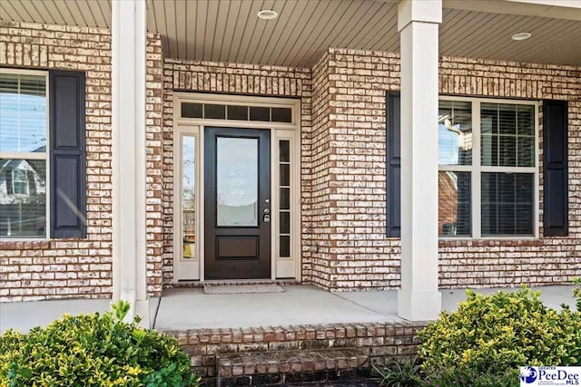 entrance to property with a porch