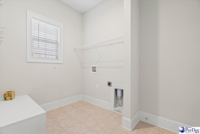 laundry room with light tile patterned flooring, hookup for a washing machine, and electric dryer hookup