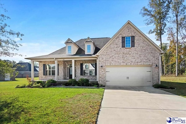 view of front of property with a porch, a garage, and a front lawn