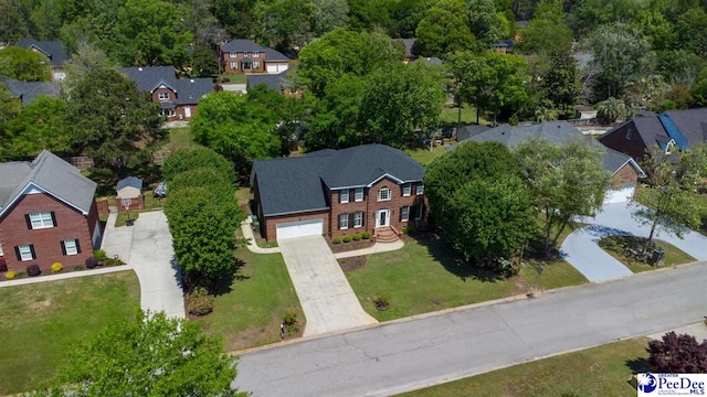 birds eye view of property with a residential view