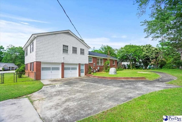 view of property exterior with fence, brick siding, a garage, a lawn, and driveway