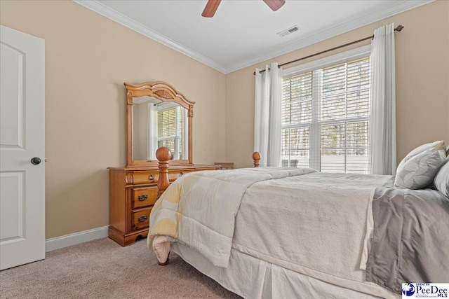 carpeted bedroom featuring multiple windows, crown molding, and ceiling fan