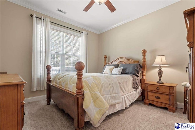 bedroom featuring crown molding, light colored carpet, and ceiling fan