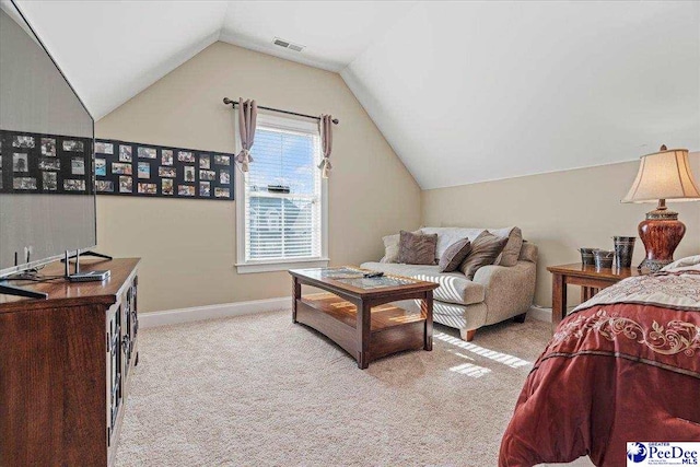 carpeted bedroom with vaulted ceiling