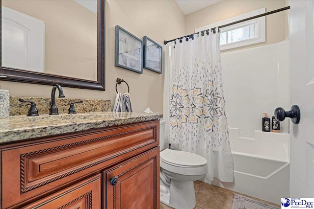 full bathroom featuring vanity, tile patterned floors, shower / bath combination with curtain, and toilet