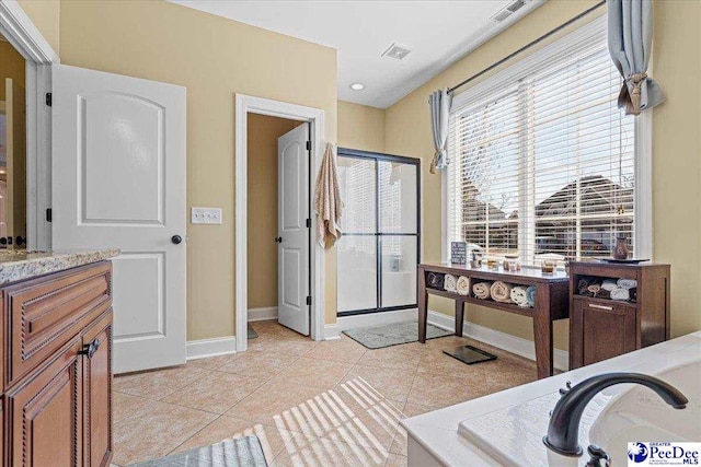 interior space with vanity and tile patterned floors