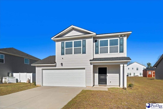 view of property featuring a garage and a front lawn