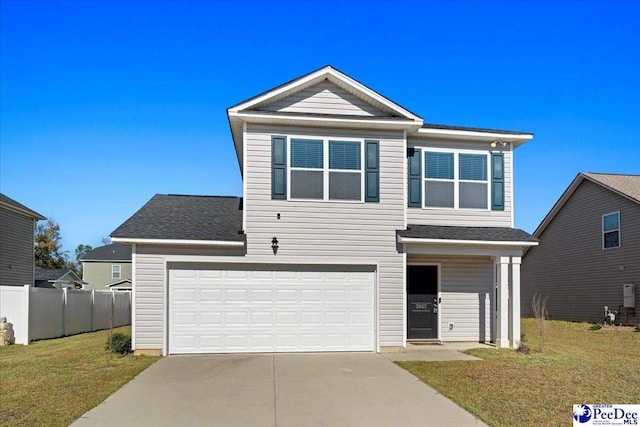 view of front of home featuring a garage and a front yard