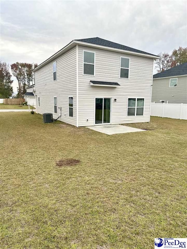 back of property with a patio and a yard