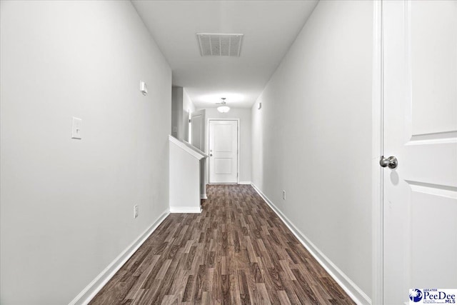 corridor featuring dark hardwood / wood-style floors