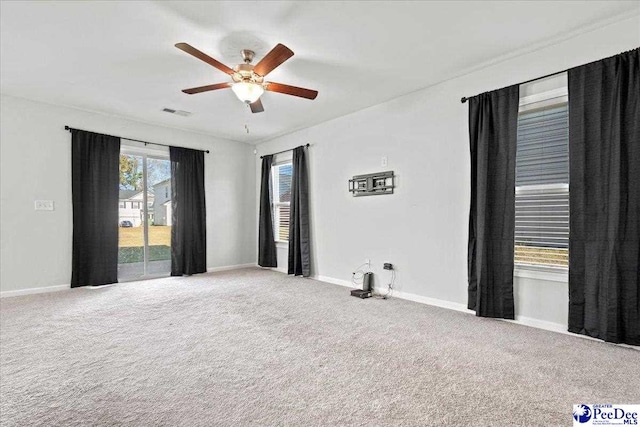 carpeted empty room with ceiling fan