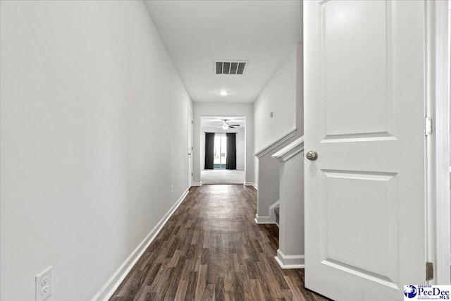 corridor featuring dark hardwood / wood-style floors