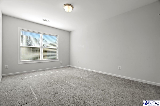 view of carpeted spare room