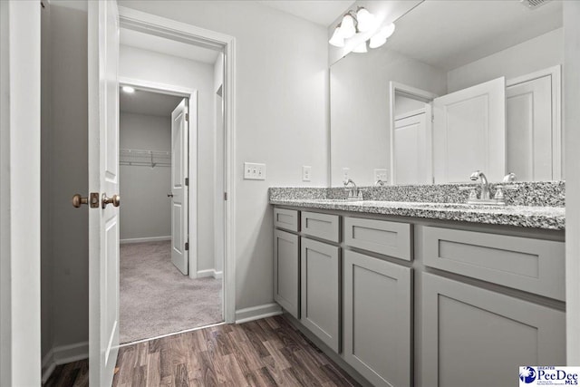 bathroom with vanity and hardwood / wood-style floors