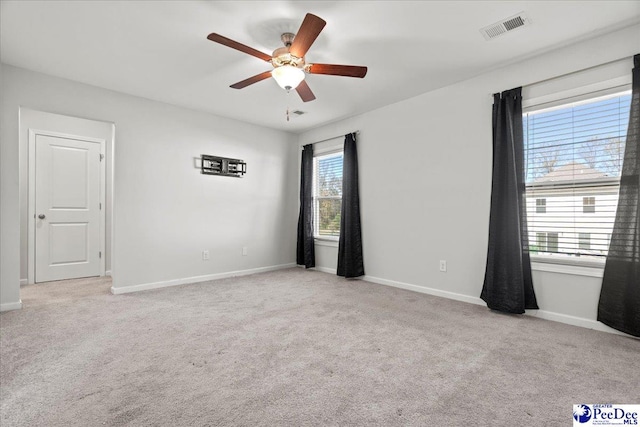 carpeted empty room with ceiling fan