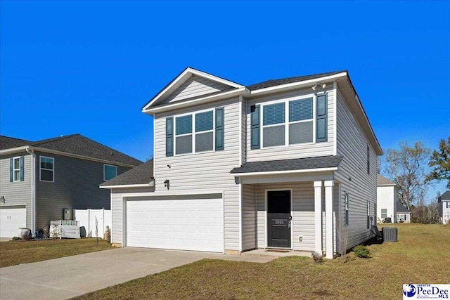 view of front of property featuring cooling unit, a garage, and a front lawn