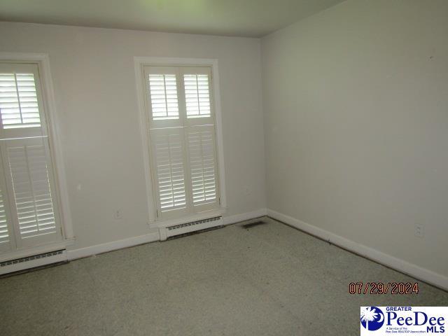 spare room with a baseboard radiator