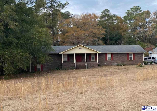 ranch-style house with covered porch