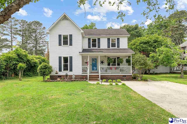 traditional home with covered porch, a front yard, and crawl space