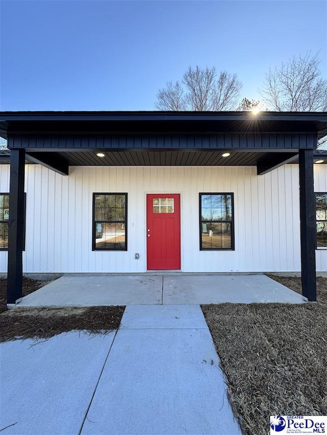 property entrance featuring a patio area