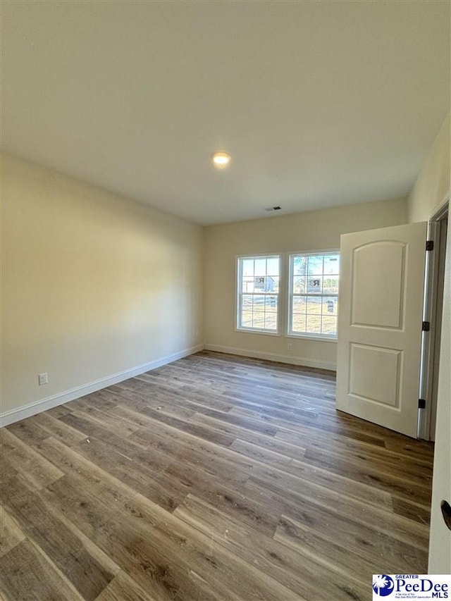 empty room featuring hardwood / wood-style floors