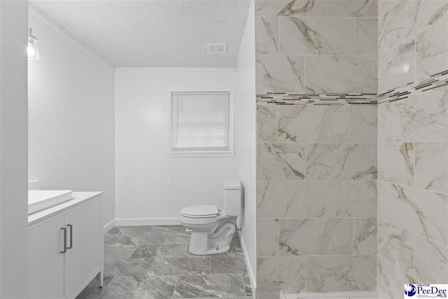 616 Sandra Ter, Florence, SC 29501 - full bath featuring a textured ceiling, baseboards, marble finish floor, toilet, and vanity
