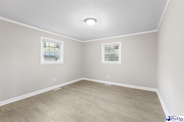 616 Sandra Ter, Florence, SC 29501 - spare room featuring baseboards, wood finished floors, crown molding, and plenty of natural light