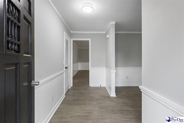 616 Sandra Ter, Florence, SC 29501 - hall featuring wainscoting, wood finished floors, ornamental molding, and a textured ceiling