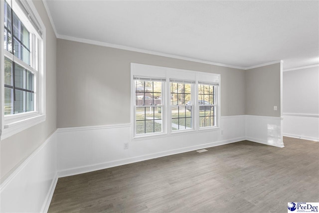 616 Sandra Ter, Florence, SC 29501 - spare room with ornamental molding, baseboards, and wood finished floors