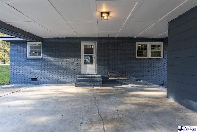 616 Sandra Ter, Florence, SC 29501 - property entrance featuring brick siding, crawl space, and a carport