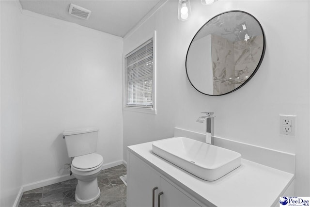 616 Sandra Ter, Florence, SC 29501 - bathroom with toilet, vanity, marble finish floor, baseboards, and visible vents